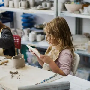 Child in a pottery class in school